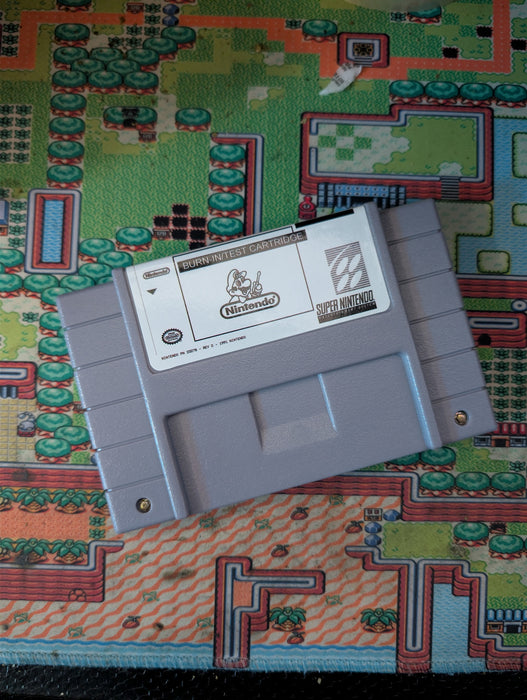 SNES Burn IN Test Cart Game cartridge on a colorful game cartridge  reprobackground