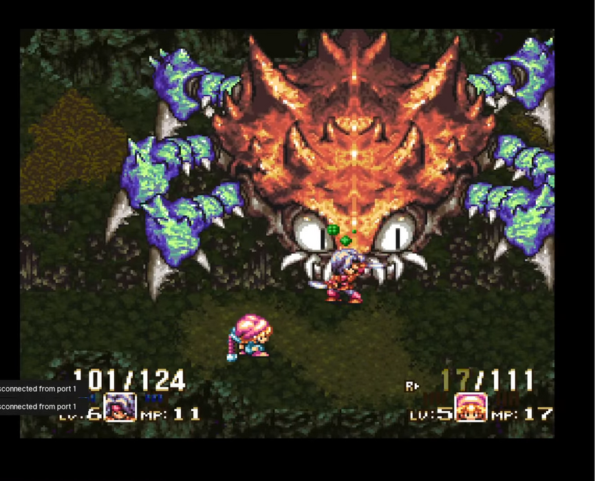 Video game screen with a large monster and player character, overlaid with a smaller inset of a person watching the game.