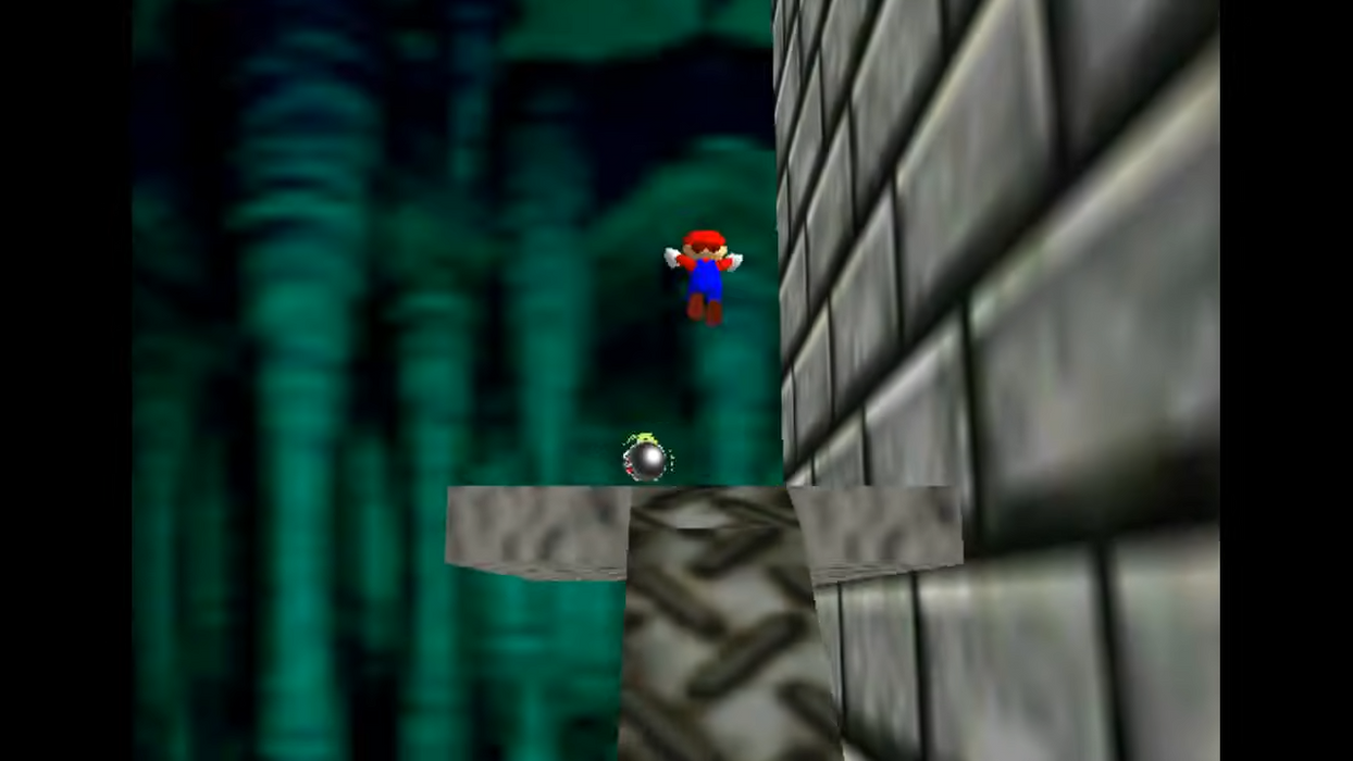 A retro video game scene showing a small Mario-like character floating above a metallic platform, with a dark green forest on the left and a gray brick wall on the right.