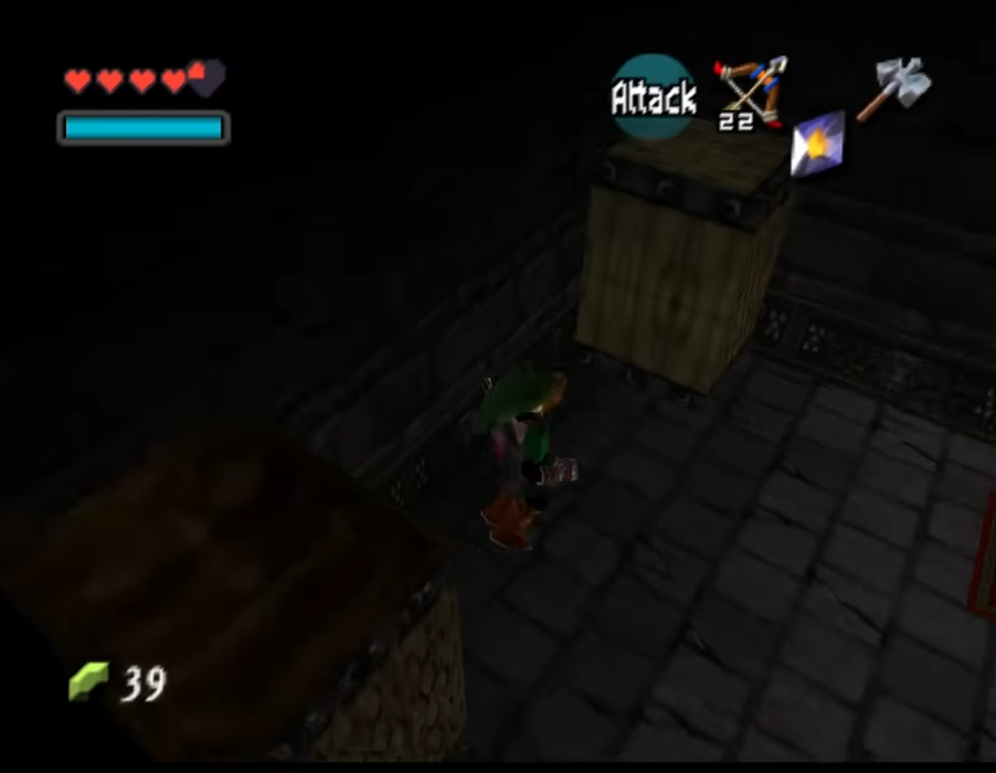 A screenshot from a retro video game showing a small green-robed character standing in a dark stone room next to wooden crates, with UI elements including hearts, a blue health bar, an attack indicator, and an axe icon.
