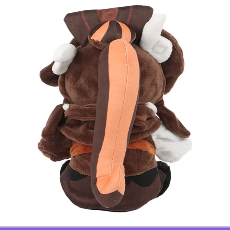 Plush toy resembling a character from 'Yu-Gi-Oh!' with brown, orange, and white colors on a white background.
